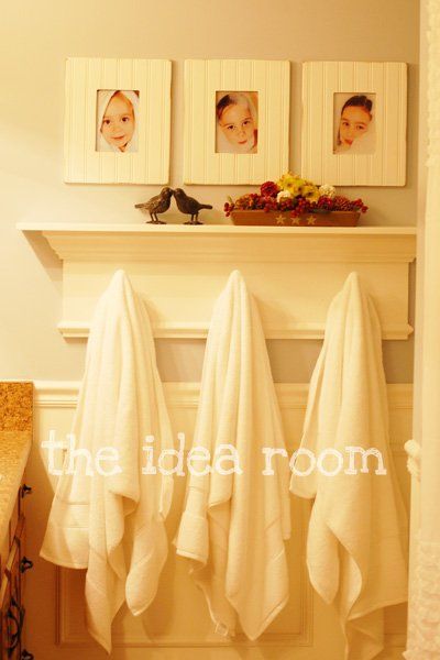 bathroom shelf with hooks for towels