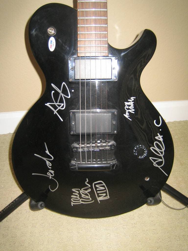 Concert-used, signed NIN guitar
