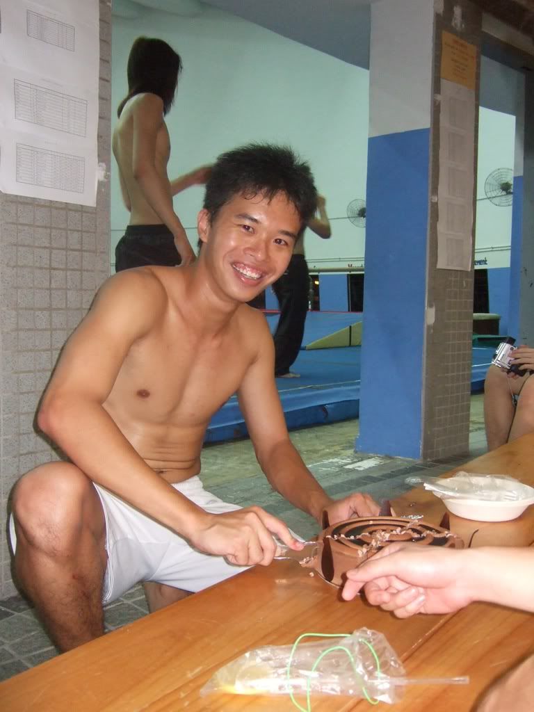 Aaron cutting his cake